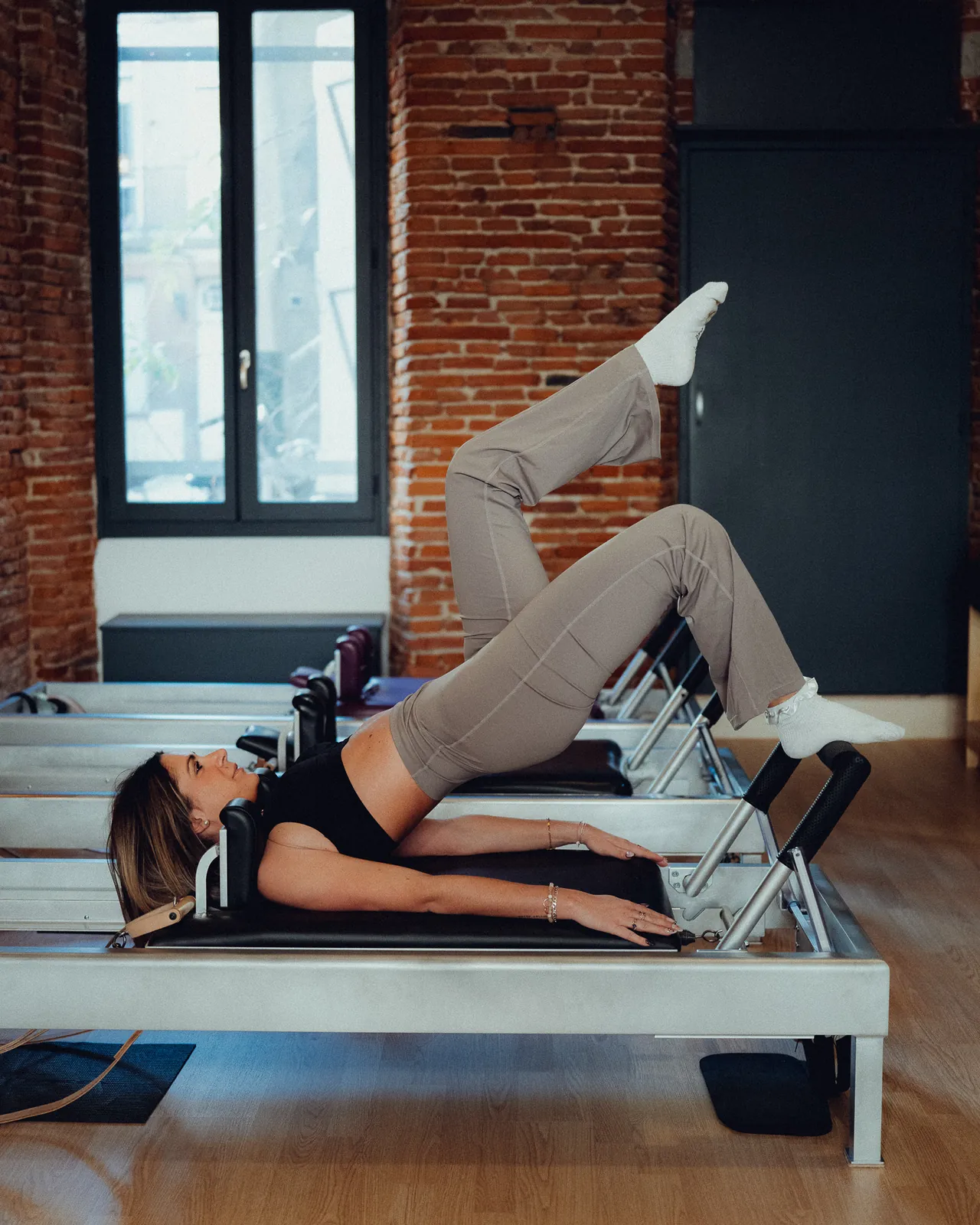 Exercice sur Reformer au studio MUXU